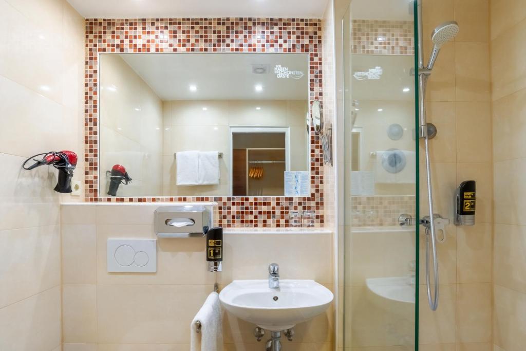 Koupelna v ubytování Hotel Astor