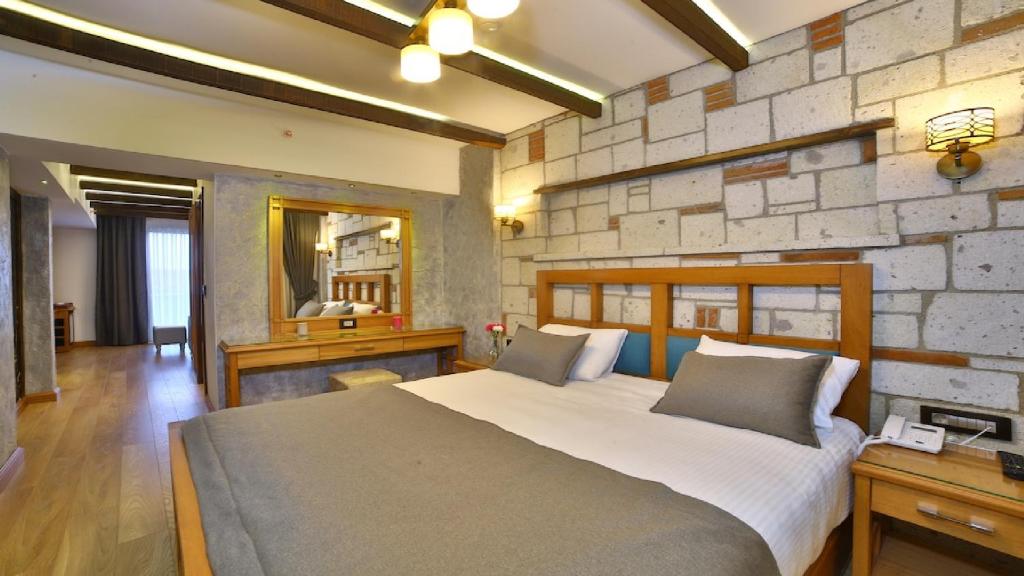 A bed or beds in a room at Yılsam Sultanahmet Hotel