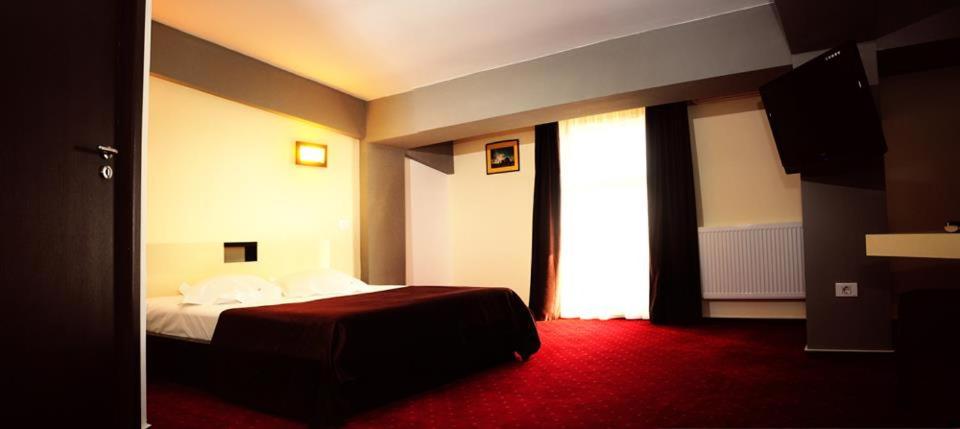Postel nebo postele na pokoji v ubytování GP Hotel