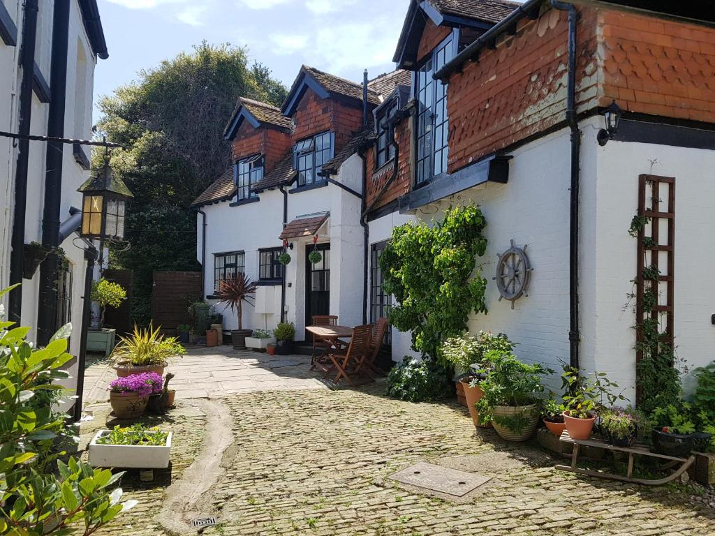 a cobblestone street in a town with buildings at The Coach House in Newport