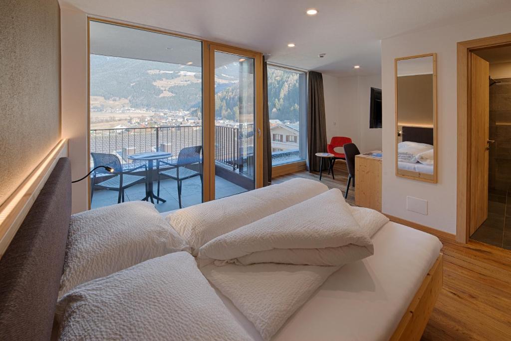 Postel nebo postele na pokoji v ubytování Hotel Mair