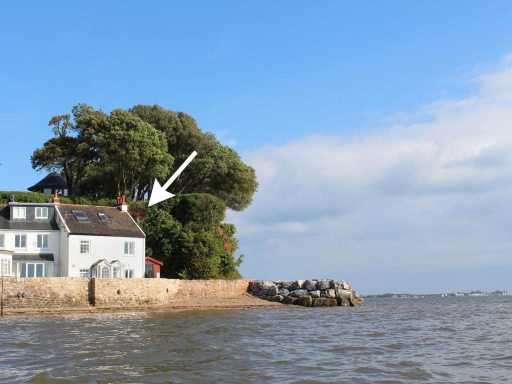 a house on an island in the water at 1 The Quay in Lympstone