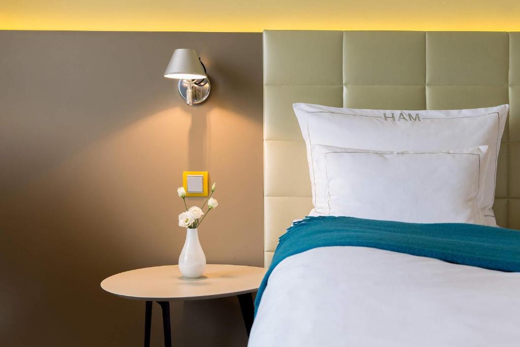 Postel nebo postele na pokoji v ubytování Hotel AM MEER & Spa