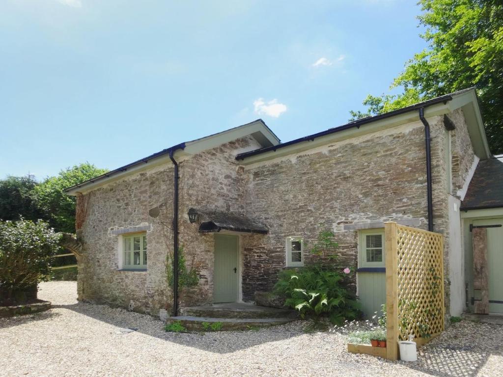 an exterior view of a stone house at Torrings Barn in Kingsbridge