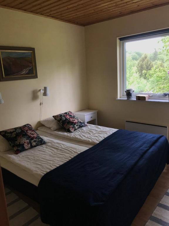 Postel nebo postele na pokoji v ubytování Ullstorps Stugor