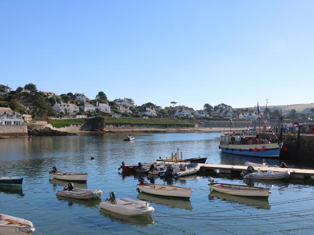 a group of boats in a body of water at Pier Cottage in Saint Mawes