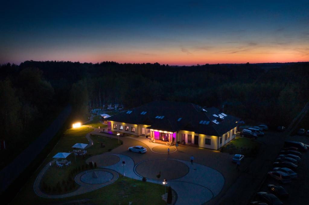 an aerial view of a building at night at Gościniec Pod Lasem in Grabowce Dolne