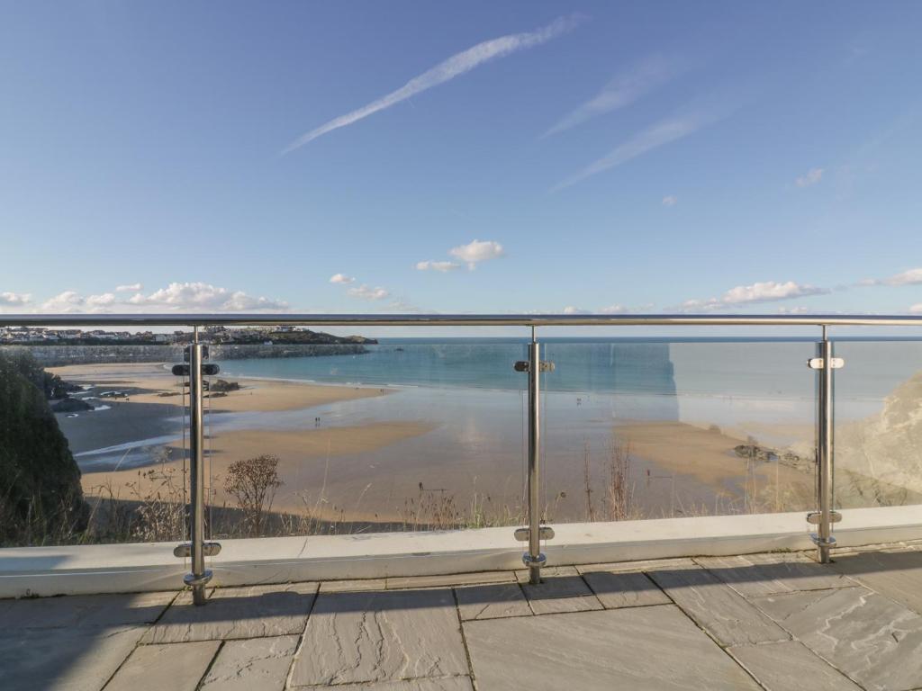 a view of a body of water from a balcony at Buena Vista in Newquay