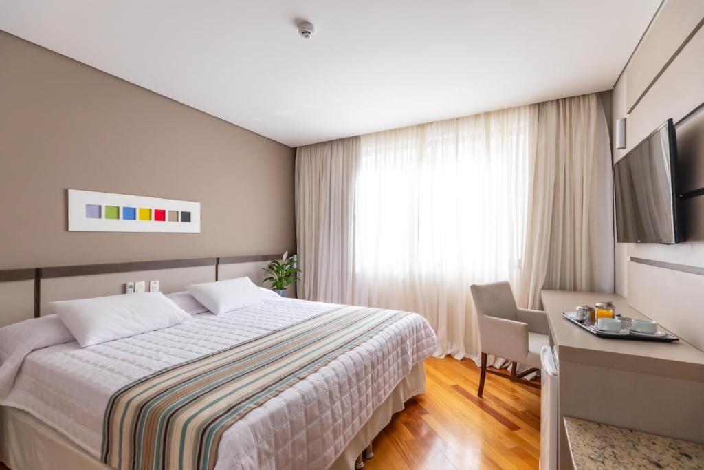 Postel nebo postele na pokoji v ubytování Viale Cataratas Hotel & Eventos