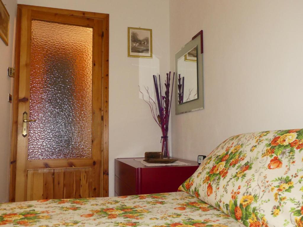 Postel nebo postele na pokoji v ubytování Casa La Forsizia