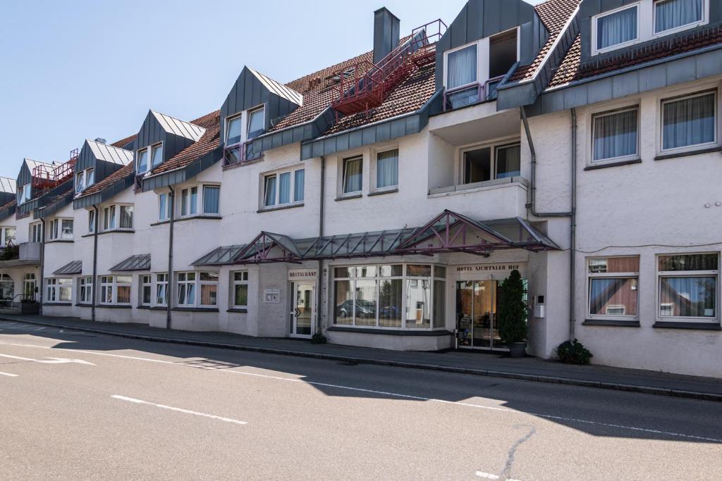 a row of buildings on the side of a street at Hotel Aichtaler Hof in Grötzingen