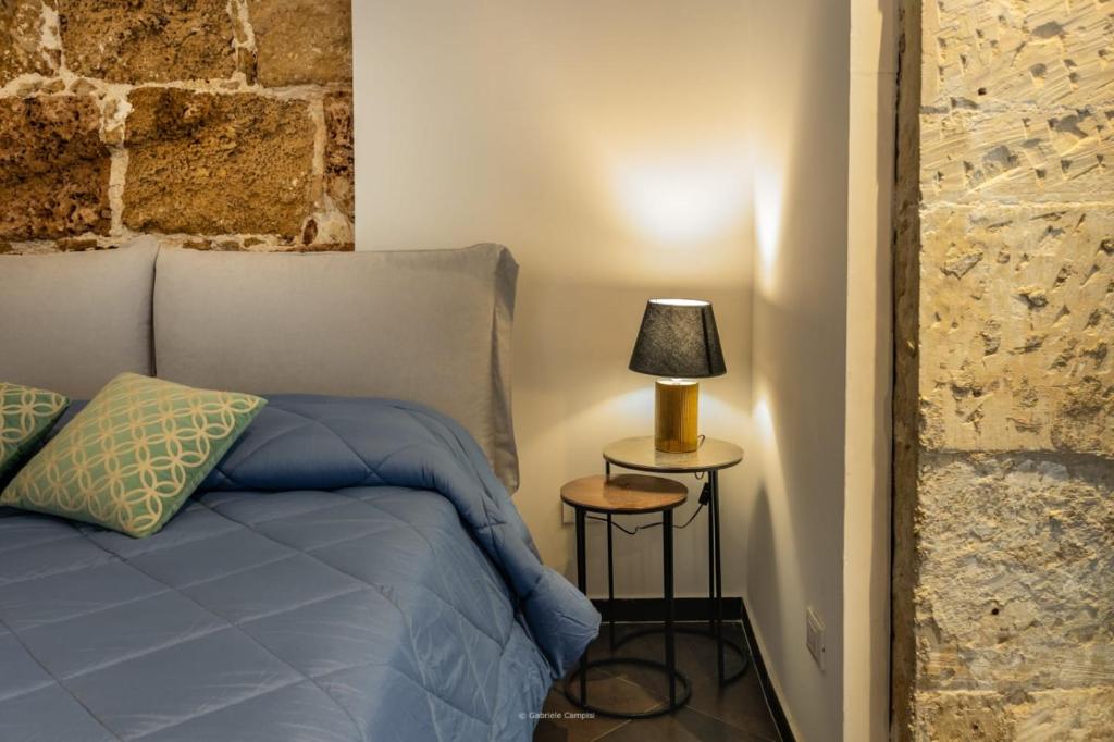 Postel nebo postele na pokoji v ubytování GARIBALDI MAISON DE CHARME