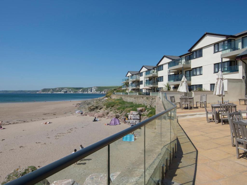 a view of the beach from the balcony of a resort at 12 Burgh Island Causeway in Kingsbridge