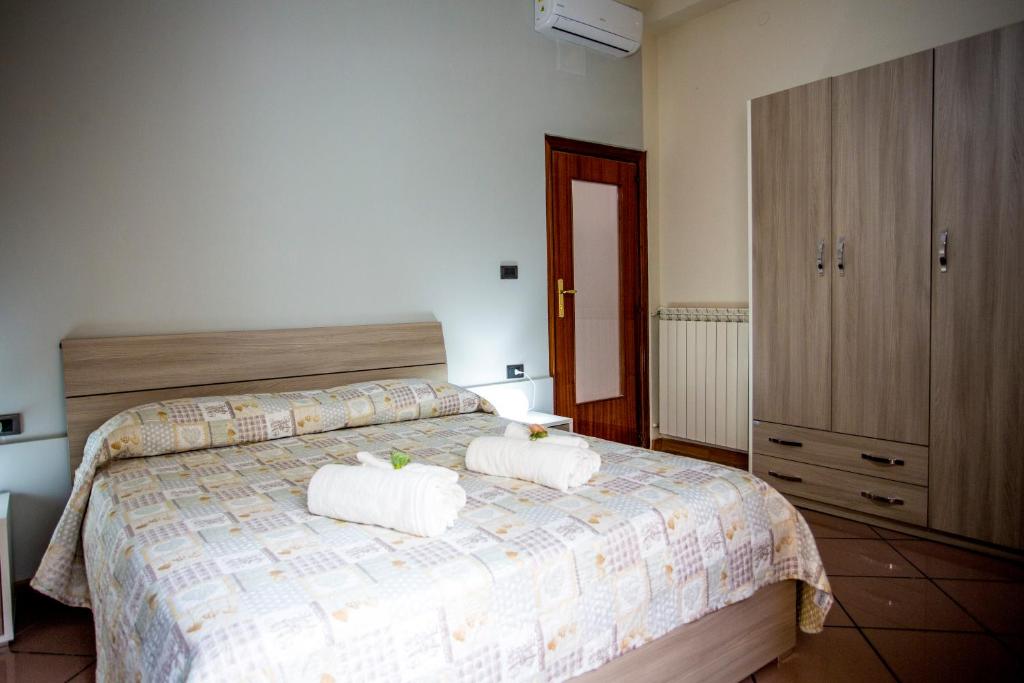 Postel nebo postele na pokoji v ubytování B&B L'Aurora CAPUA