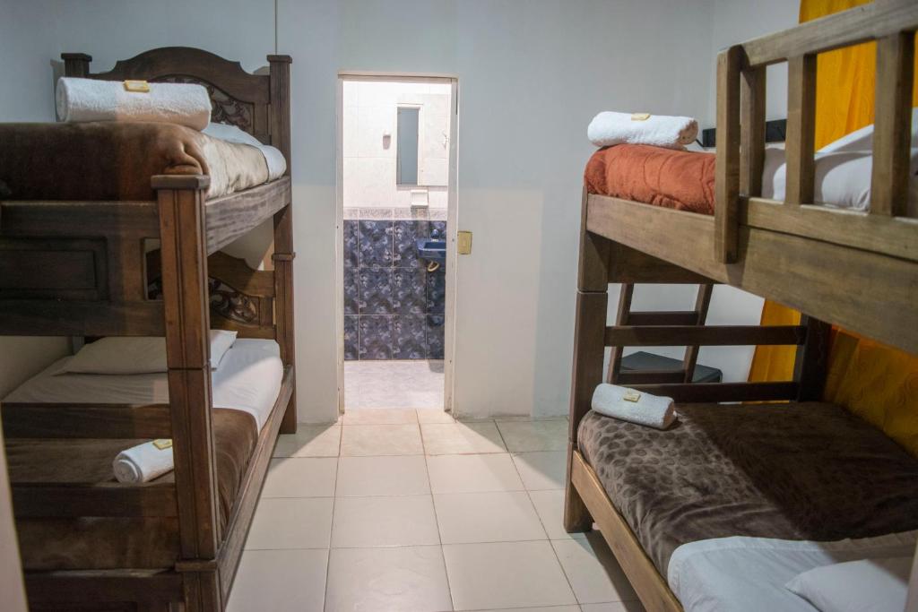 Postel nebo postele na pokoji v ubytování Ulucaho Hostel
