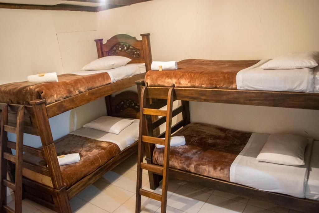 Postel nebo postele na pokoji v ubytování Ulucaho Hostel