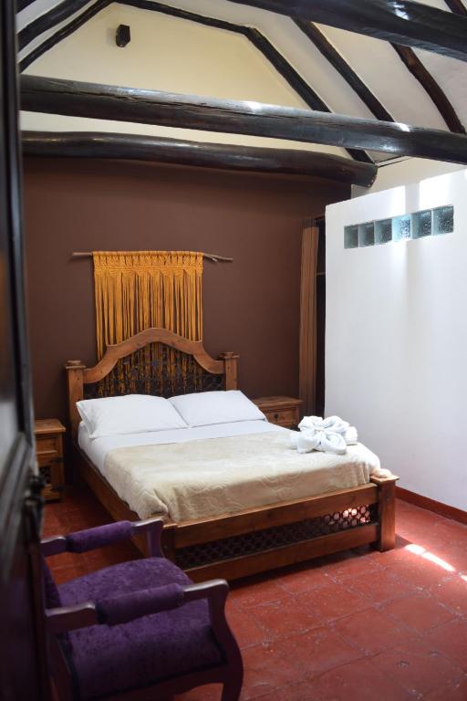 Voodi või voodid majutusasutuse Ulucaho Hostel toas