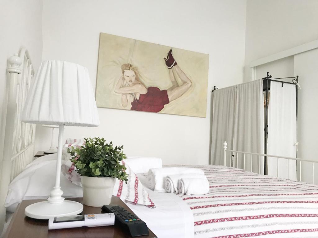 Łóżko lub łóżka w pokoju w obiekcie B&B La Corte