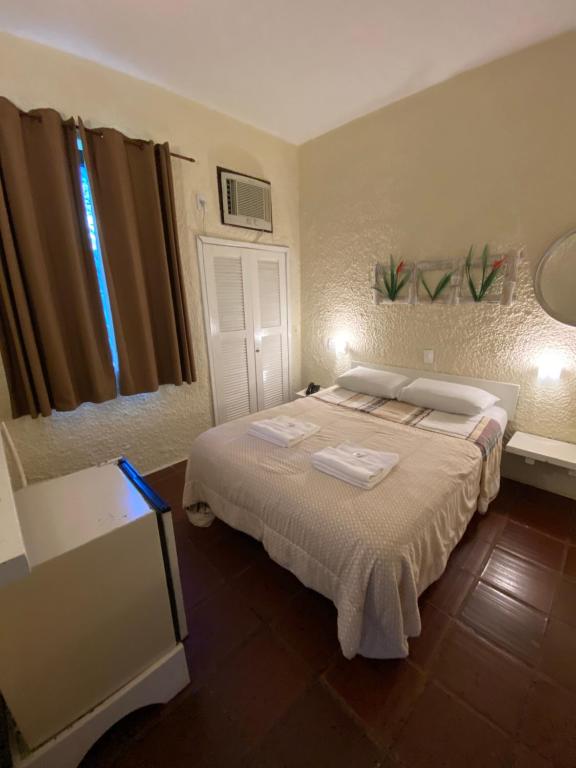 Cama ou camas em um quarto em Palace Hotel