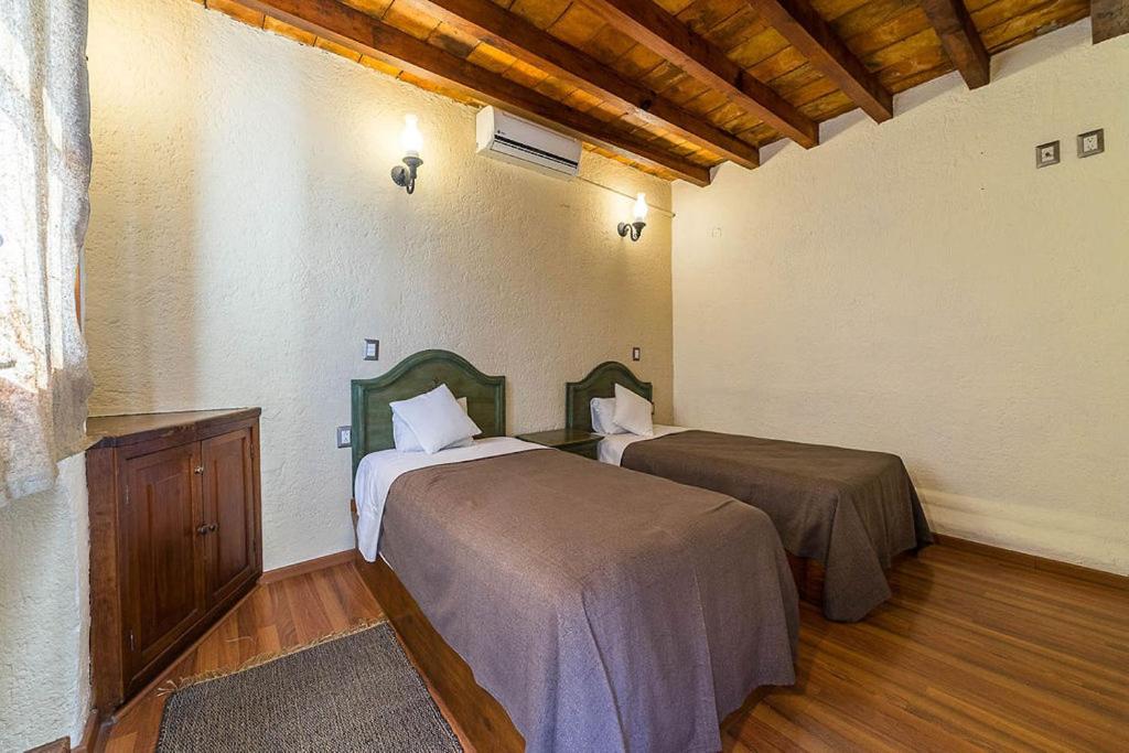 Postel nebo postele na pokoji v ubytování Mesón de la Merced Hotel Boutique Patio & Spa