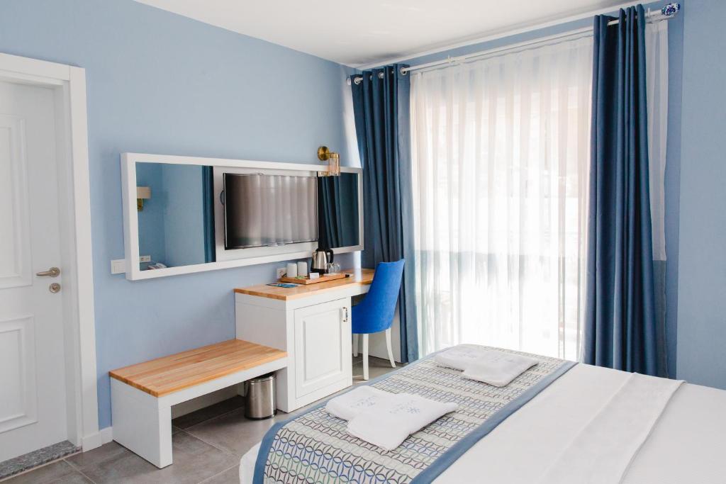 En eller flere senge i et værelse på Luvi Kaş Otel - Adults Only (+16)