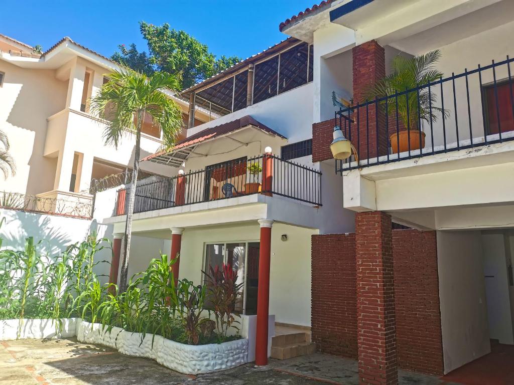 a view of a house with a balcony at Perla de Sosua in Sosúa