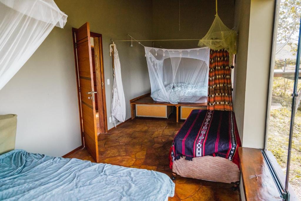 Postel nebo postele na pokoji v ubytování Vila Paraíso