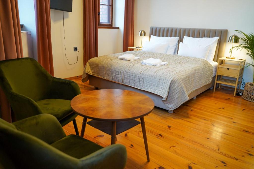 Posteľ alebo postele v izbe v ubytovaní Apartamenty w Wieży