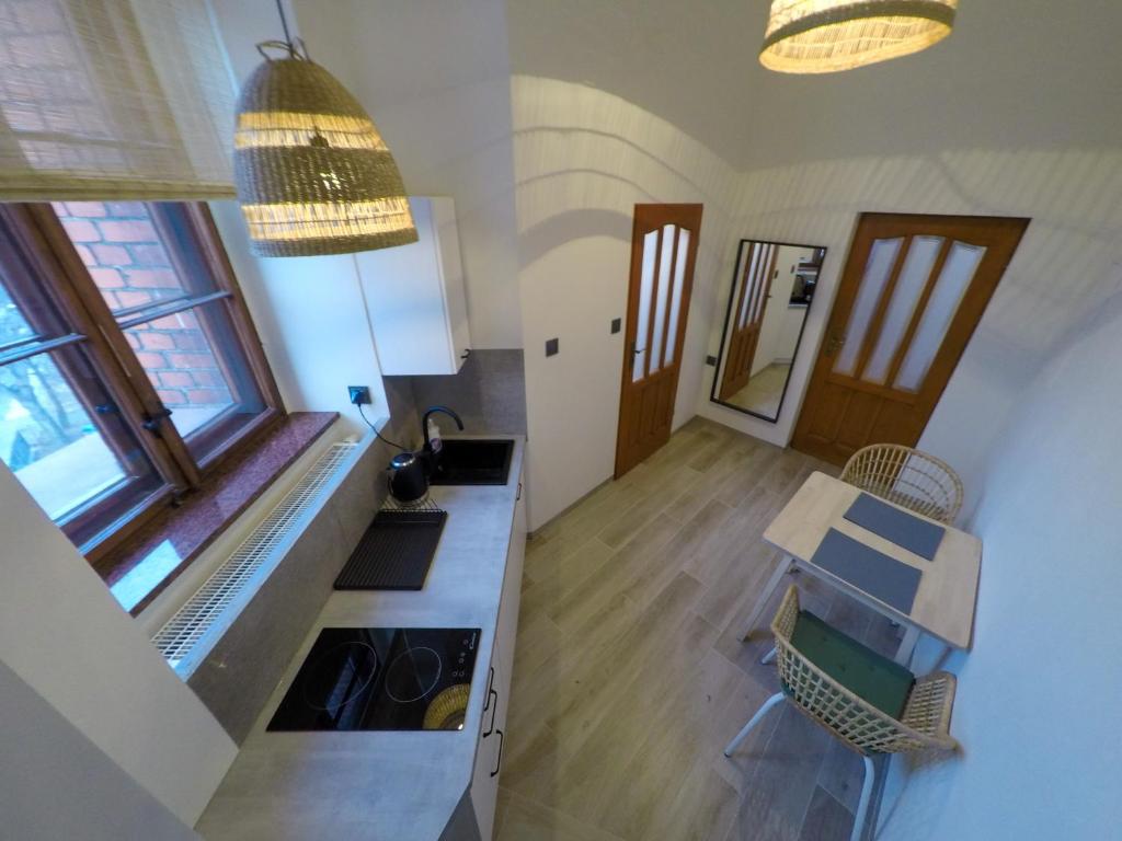 Kuchyňa alebo kuchynka v ubytovaní Apartamenty w Wieży