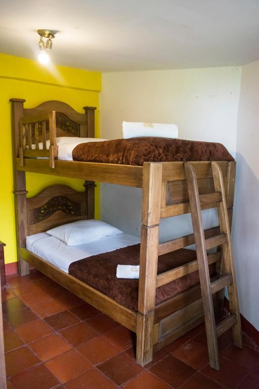 Postel nebo postele na pokoji v ubytování Ulucaho Hostel