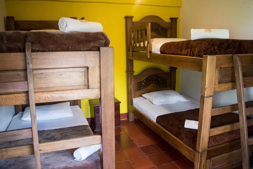 Postel nebo postele na pokoji v ubytování Ulucaho Hostel
