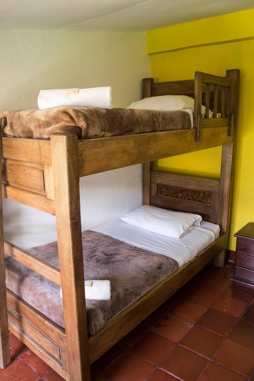Postel nebo postele na pokoji v ubytování Ulucaho Hostel