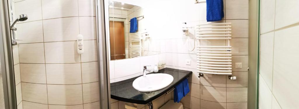 Koupelna v ubytování Hotel Alpha