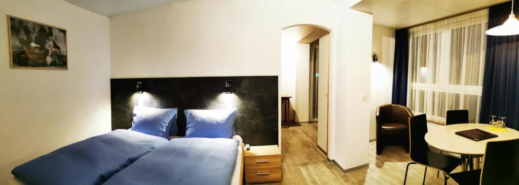 Postel nebo postele na pokoji v ubytování Hotel Alpha