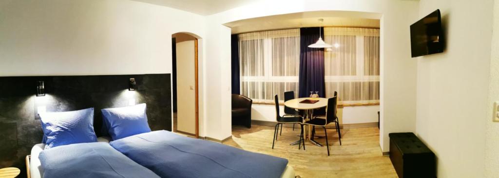 Postel nebo postele na pokoji v ubytování Hotel Alpha