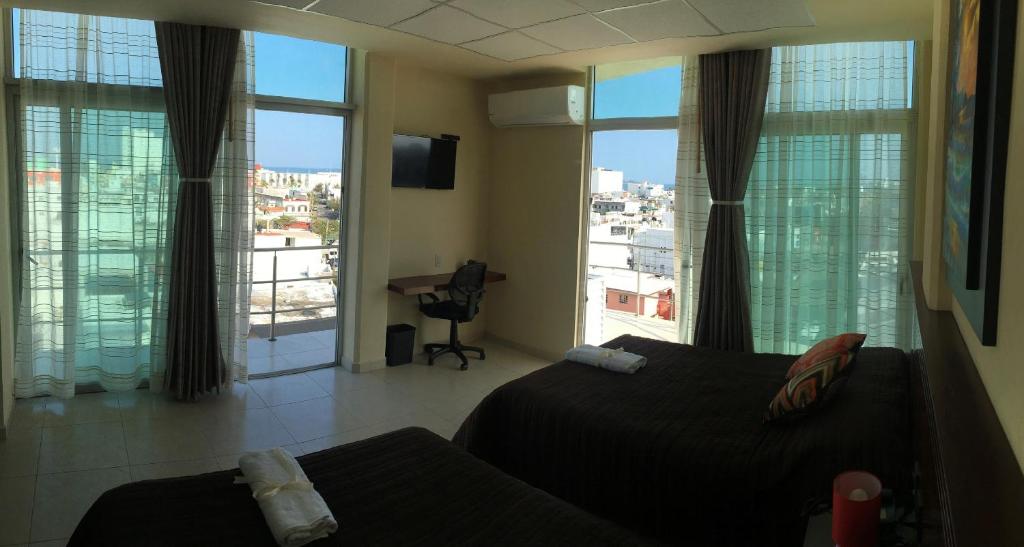 TV a/nebo společenská místnost v ubytování Harbour Inn - Veracruz