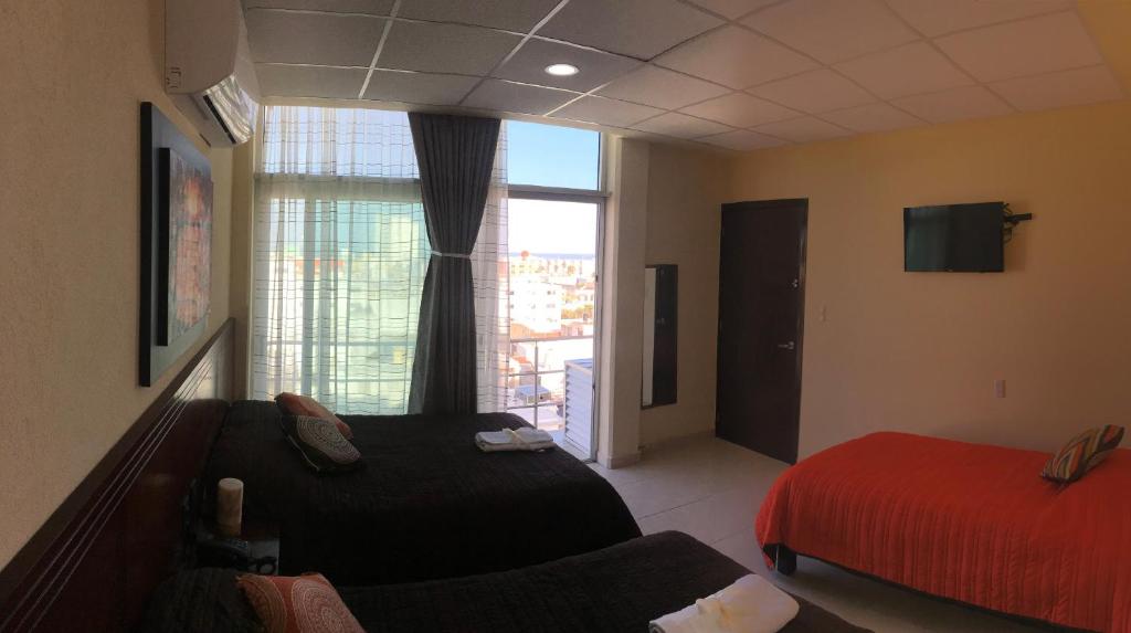 TV a/nebo společenská místnost v ubytování Harbour Inn - Veracruz