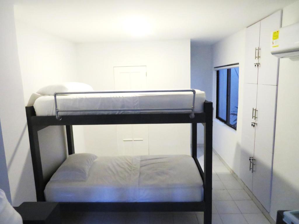 Postel nebo postele na pokoji v ubytování SAN JACINTO HOSTEL
