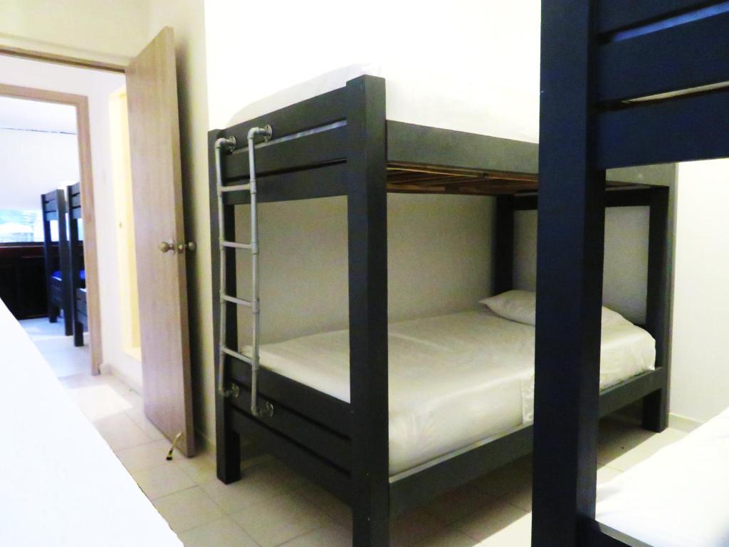 Postel nebo postele na pokoji v ubytování SAN JACINTO HOSTEL
