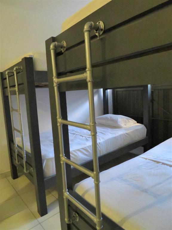 Postel nebo postele na pokoji v ubytování SAN JACINTO HOSTEL