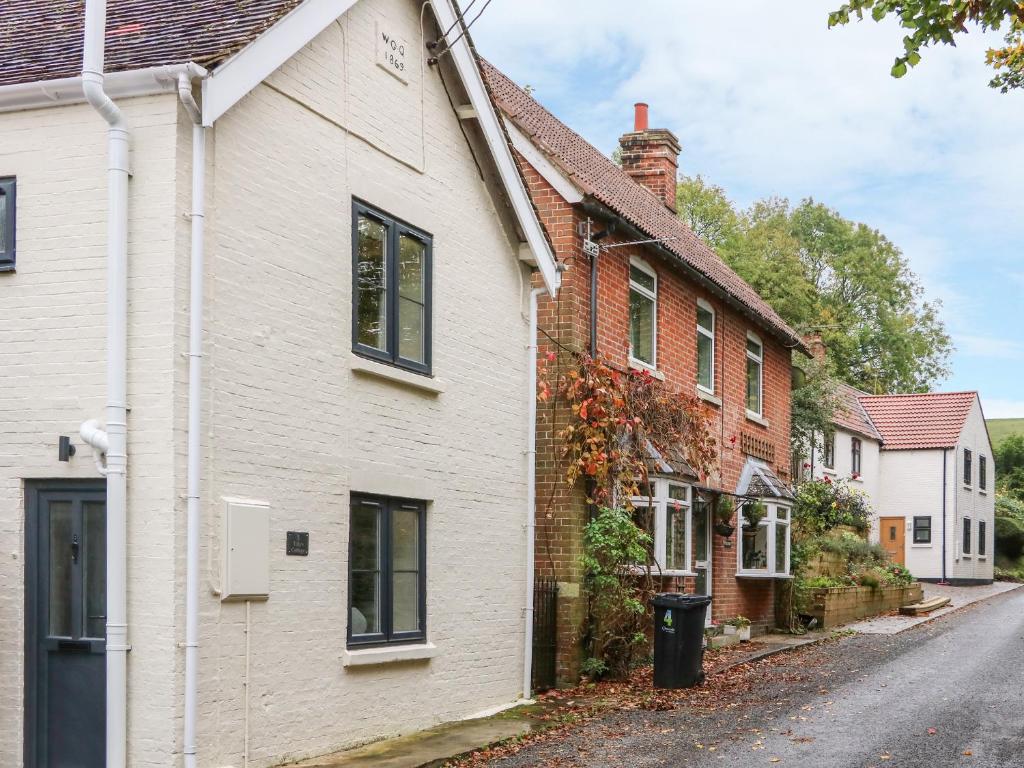 a row of houses in a residential street at Tilly's Cottage in Westbury