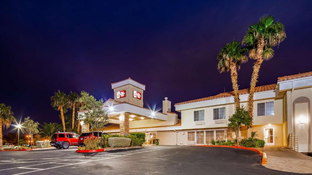 a building with a clock tower in a parking lot at Best Western Plus Las Vegas West in Las Vegas