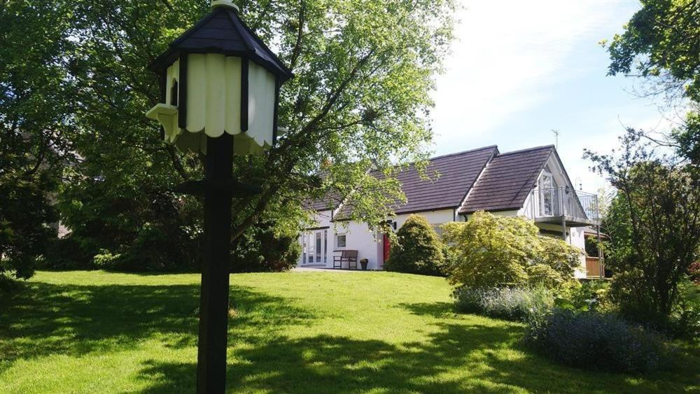 a street light in the yard of a house at Pond Cottage in New Quay