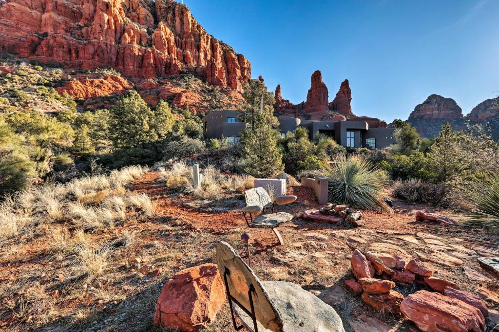 a house in the desert with a mountain in the background at Sedona Studio with Amazing View and On-Site Hiking! in Sedona