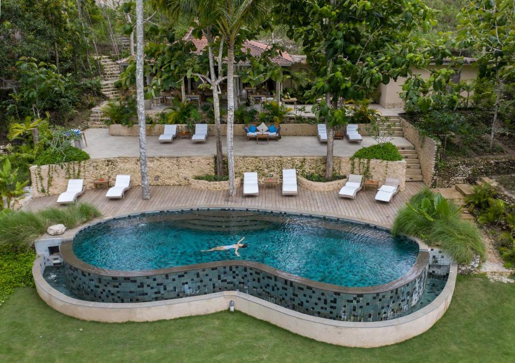 an overhead view of a swimming pool in a resort at The Mesare Eco Resort in Nusa Penida
