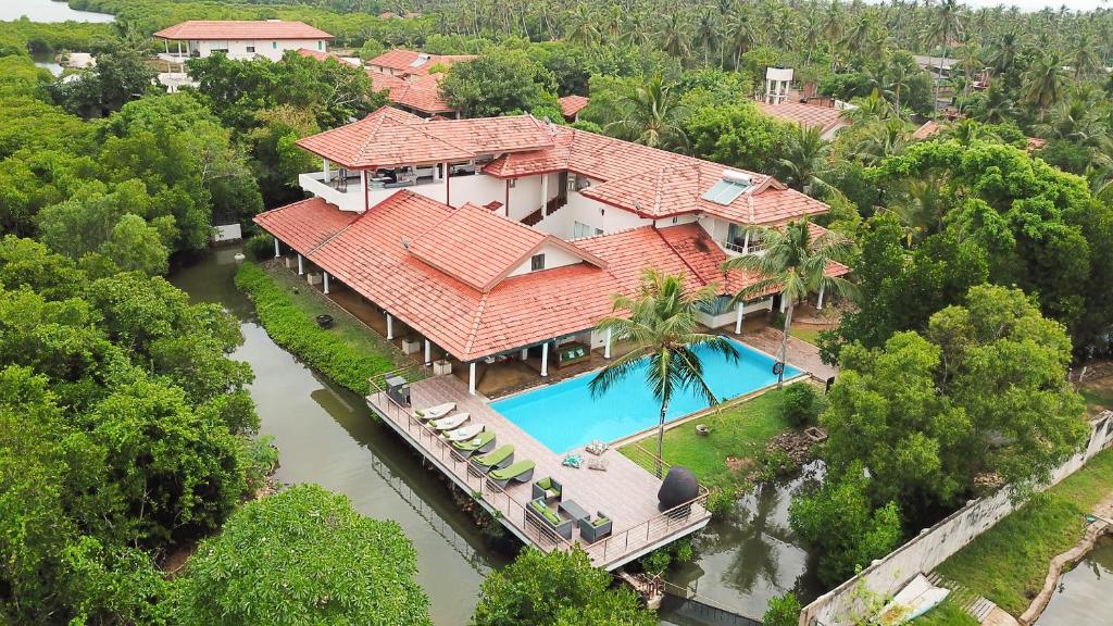 an aerial view of a house with a swimming pool at Villa Hundira in Negombo