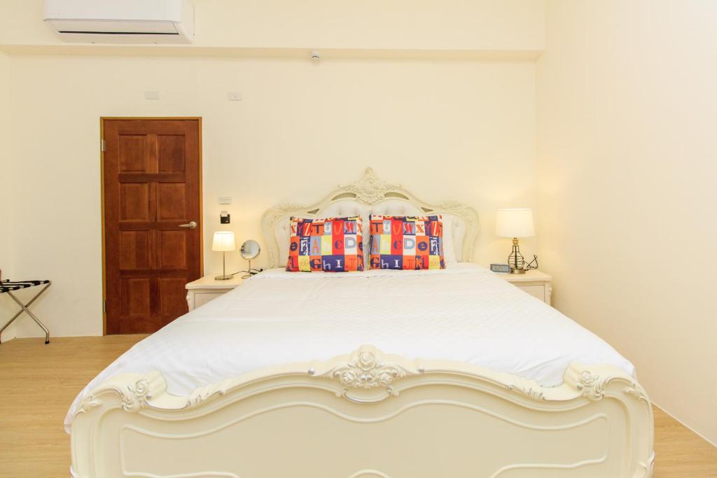 Letto o letti in una camera di Qing Ping Jn Humanities Hall青萍居人文會館