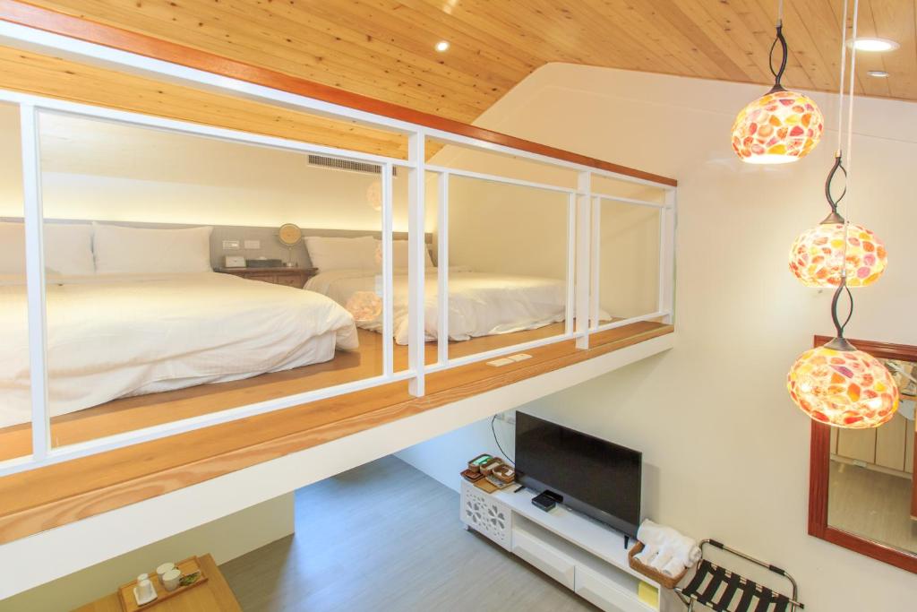 Letto o letti in una camera di Qing Ping Jn Humanities Hall青萍居人文會館