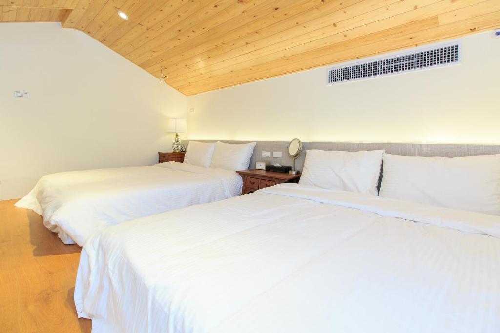 Letto o letti in una camera di Qing Ping Jn Humanities Hall青萍居人文會館