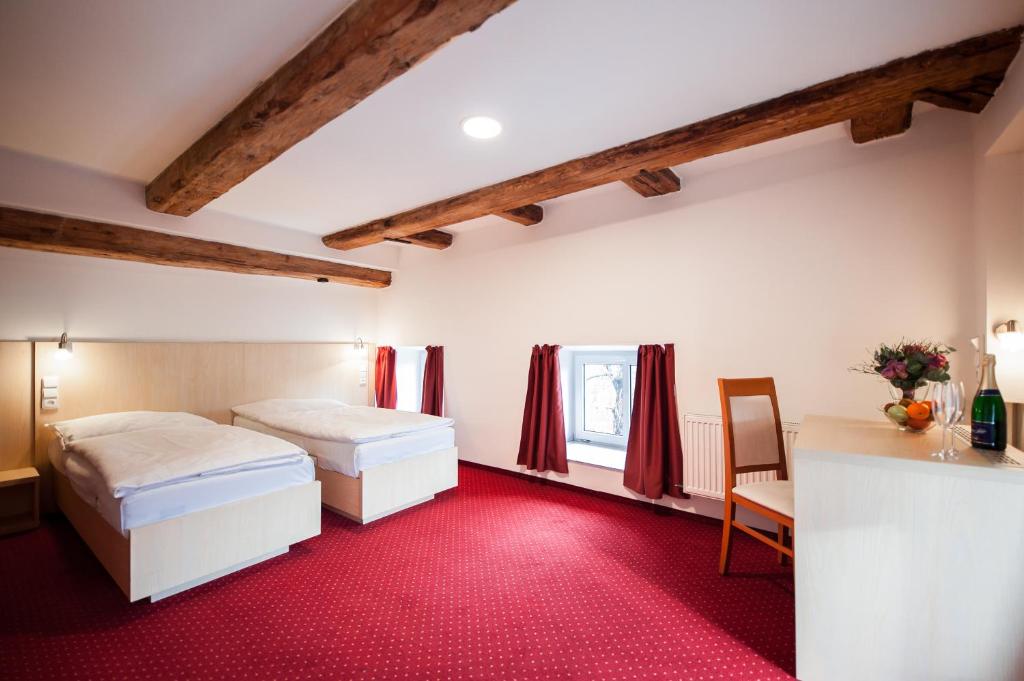 Postel nebo postele na pokoji v ubytování Hotel Pivovar
